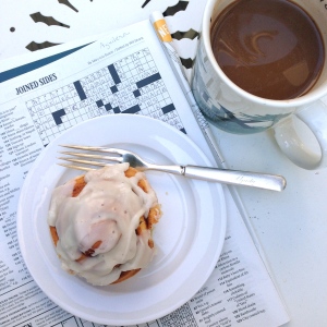Saturday, May 10th, morning with previous week's NYT Corssword puzzle & cinnamon roll from "flour.sugar.eggs" Nashville